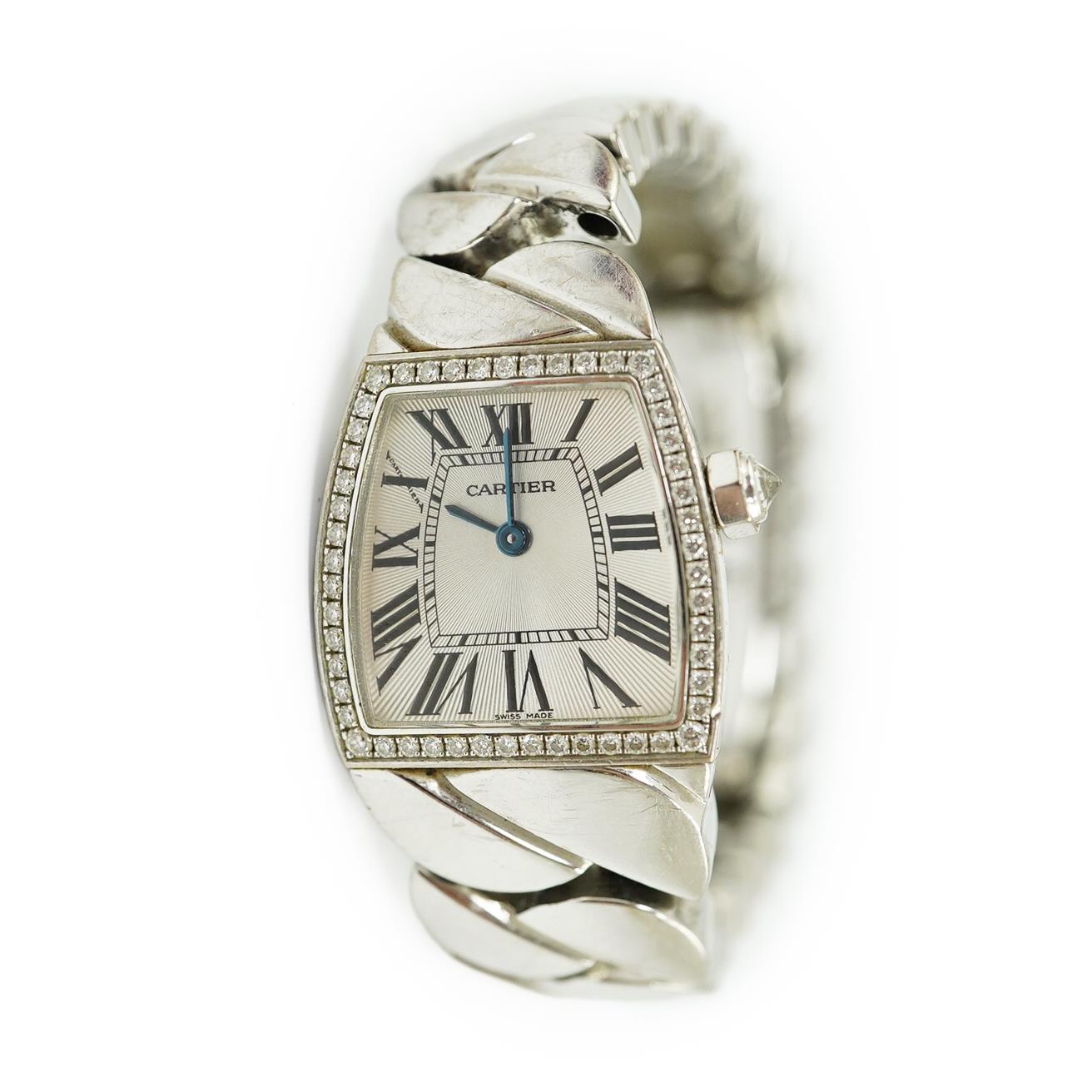 A lady's recent 18ct white gold and diamond set Cartier La Dona quartz wrist watch, on an 18ct white gold Cartier bracelet